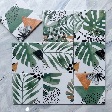 Gạch bông 20x20 màu trắng hoạ tiết lá cây xanh và hình tam giác bề mặt mờ