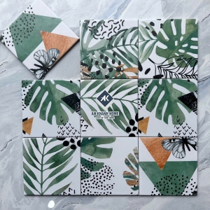 Gạch bông 20x20 màu trắng hoạ tiết lá cây xanh và hình tam giác bề mặt mờ