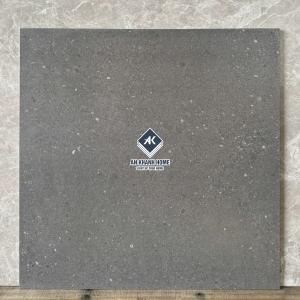 Gạch 60x60 màu xám đen mix hạt terrazzo đá mài hạt chìm mờ