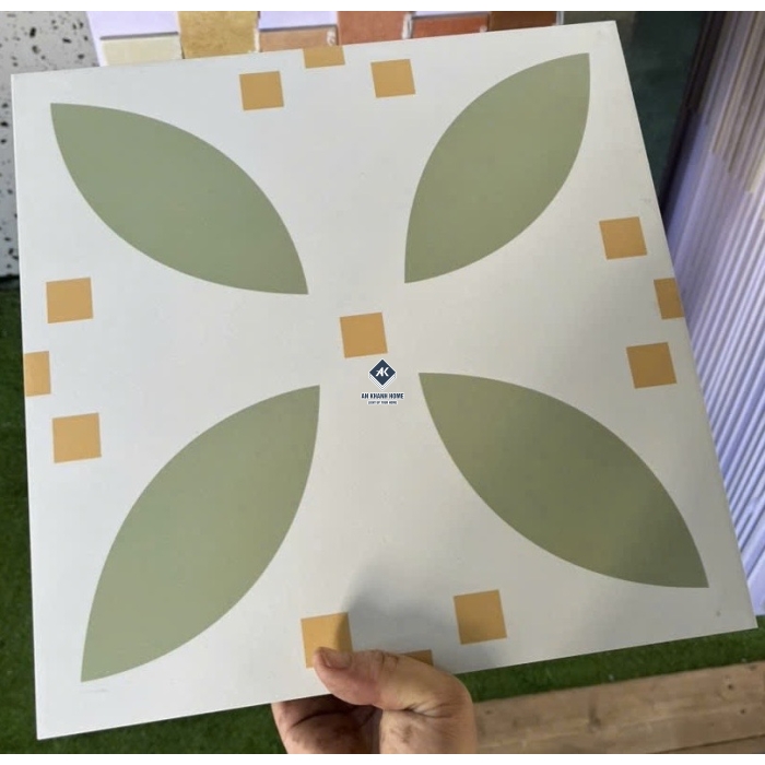Gạch bông 30x30 màu kem hoạ tiết hoa 4 cánh màu xanh lá non chấm cam